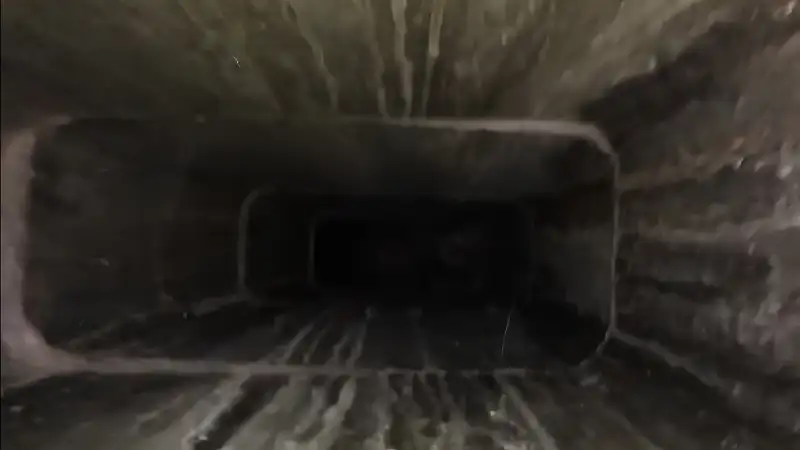 Visual signs of soot buildup and flue damage needing cleaning