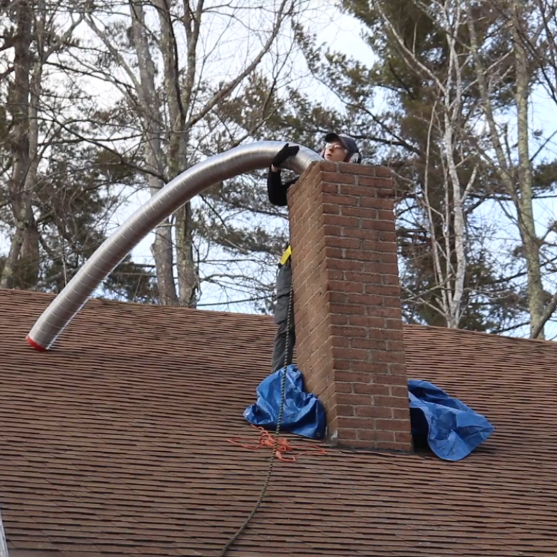 Clay tile flue liners inside a brick chimney structure