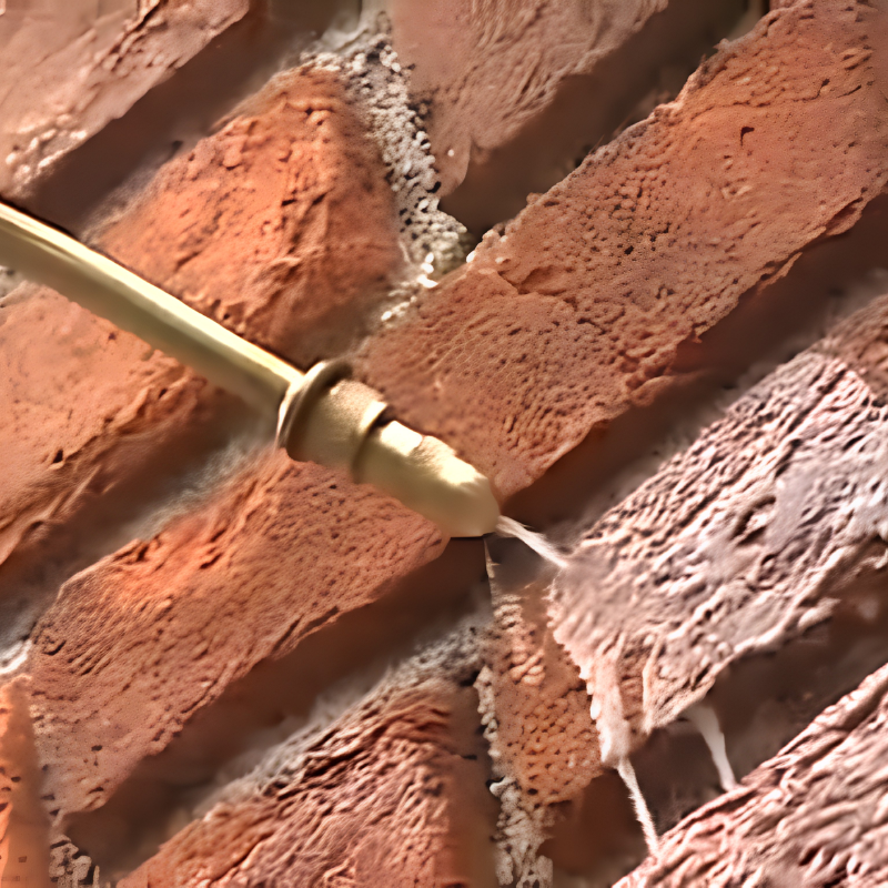Waterproofing sealant spray applied to brick chimney masonry