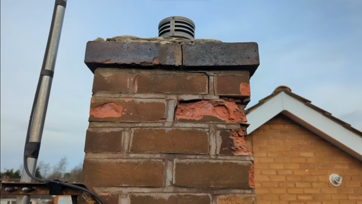 Cracks and damage on chimney crown requiring immediate repointing or rebuilding